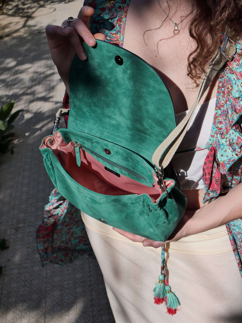 Janis flap bag in green suede with pink lining