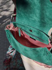 Janis flap bag in green suede with pink lining