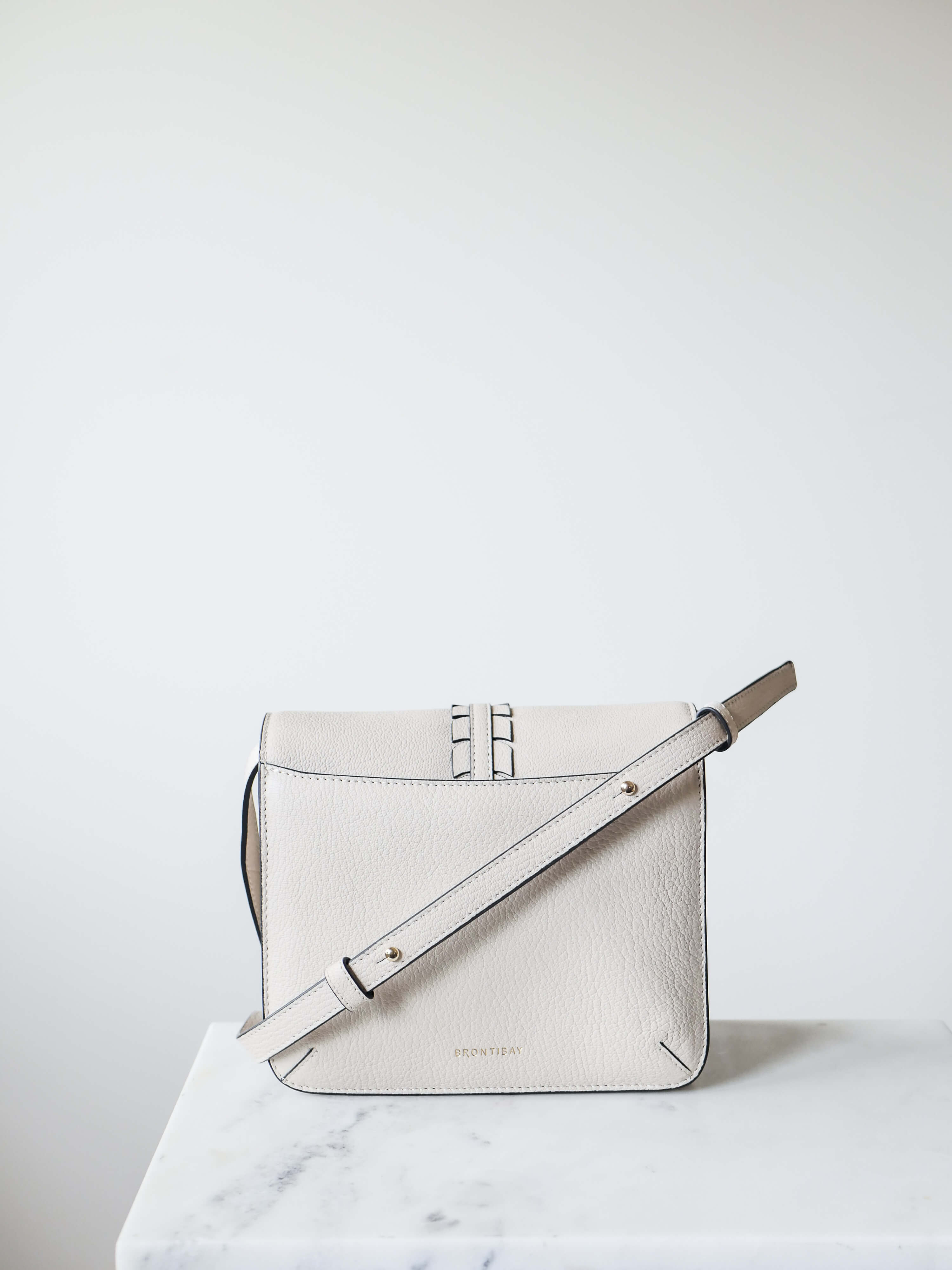 crossbody oat colored leather flap bag
